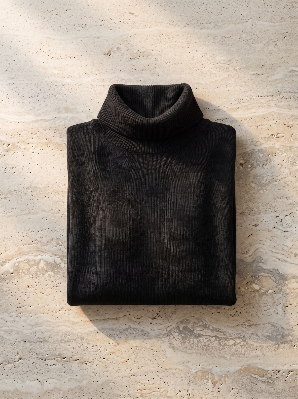 Hesper oversized roll neck knit top folded neatly on a table