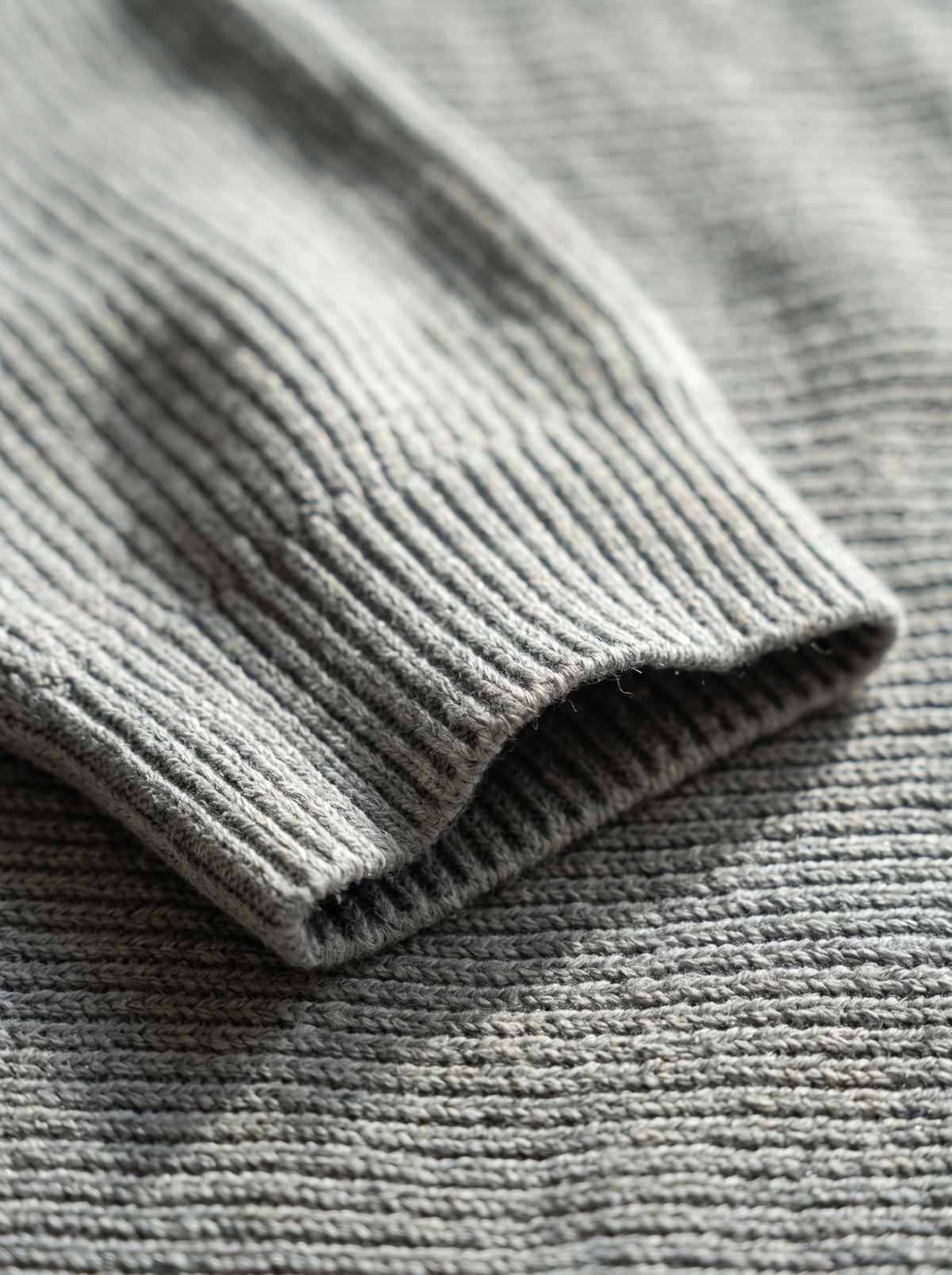Detail of the Giselle three quarter sleeve knit sweater showing its material and finish