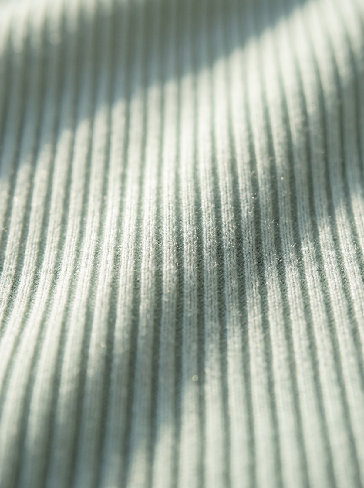 Close up of the fabric of the Clarisse roll neck ribbed sweater