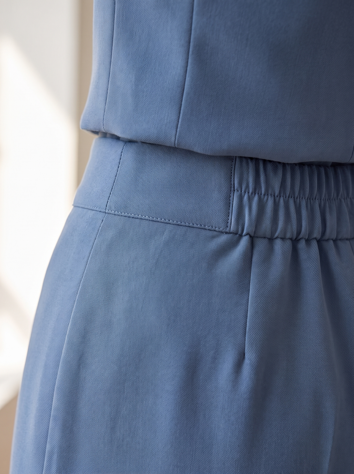 Detail of the Pomeline wide leg blazer suit set showing its material and finish