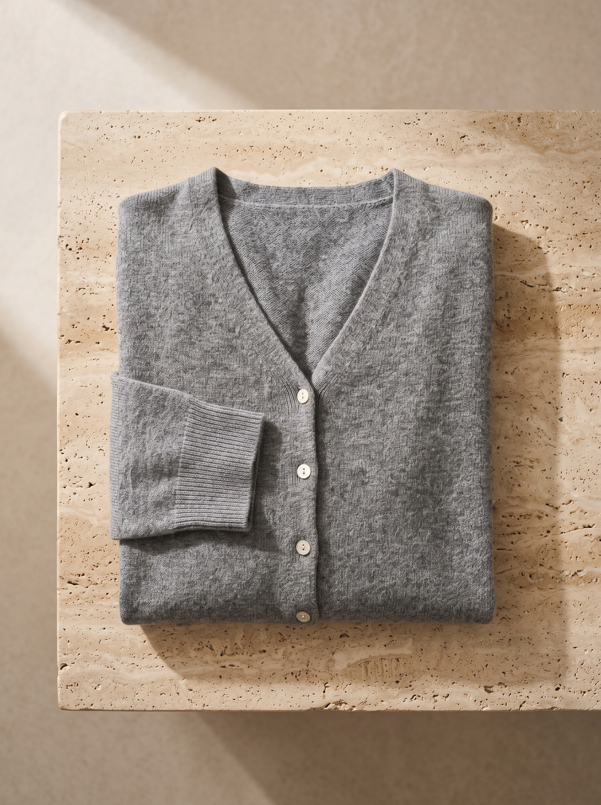 Henriette v neck cardigan folded neatly on a table