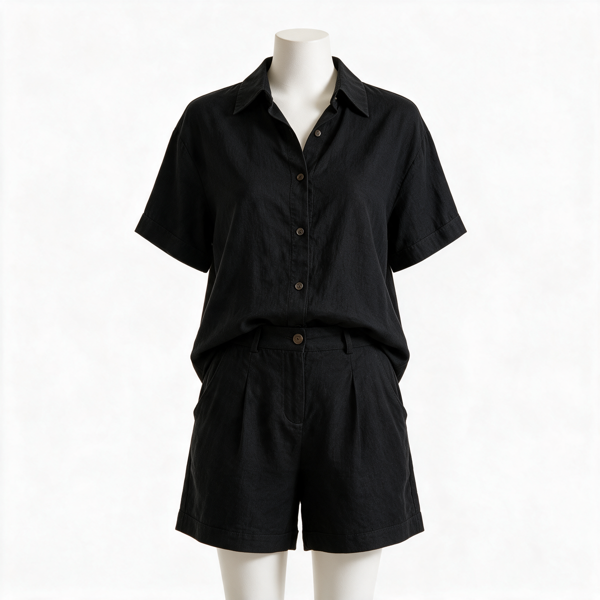 Aneta button-down shorts set in black on a plain background