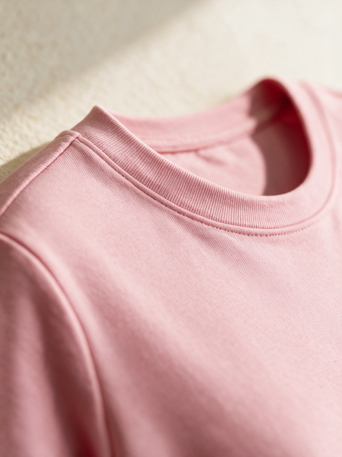 Ribbed crew neckline detail of the Lucienne top