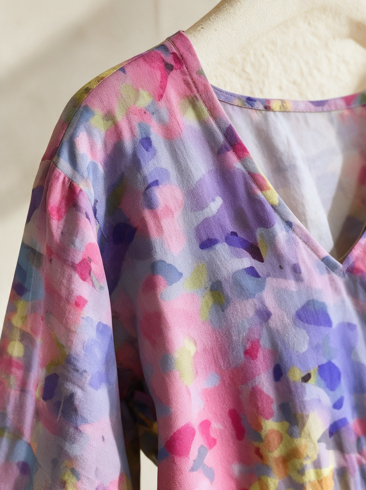 Seraphine dress V neckline and shoulder seam close up