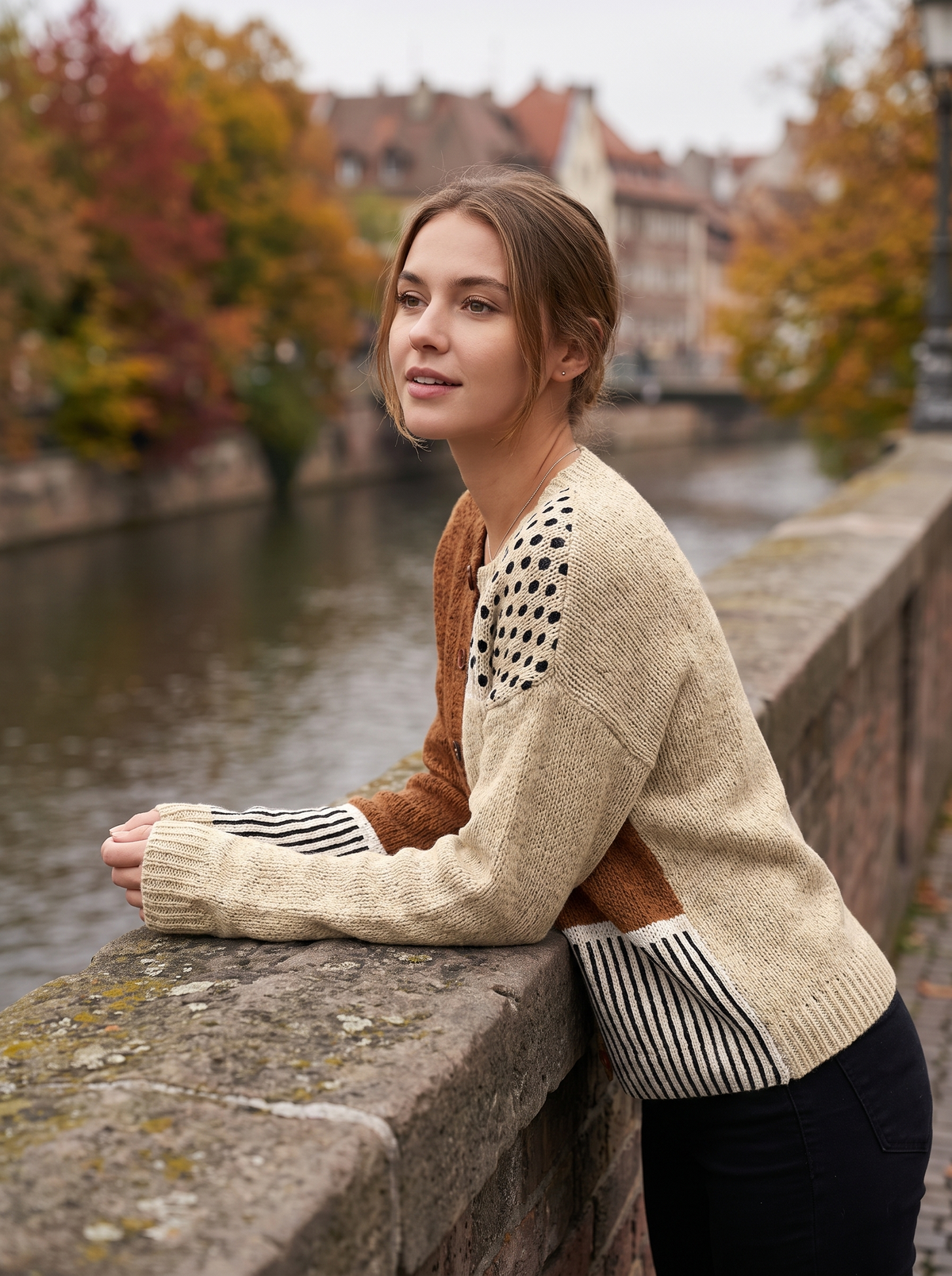 Ninette polka dot polka dot cardigan worn by a model on a city bridge in autumn