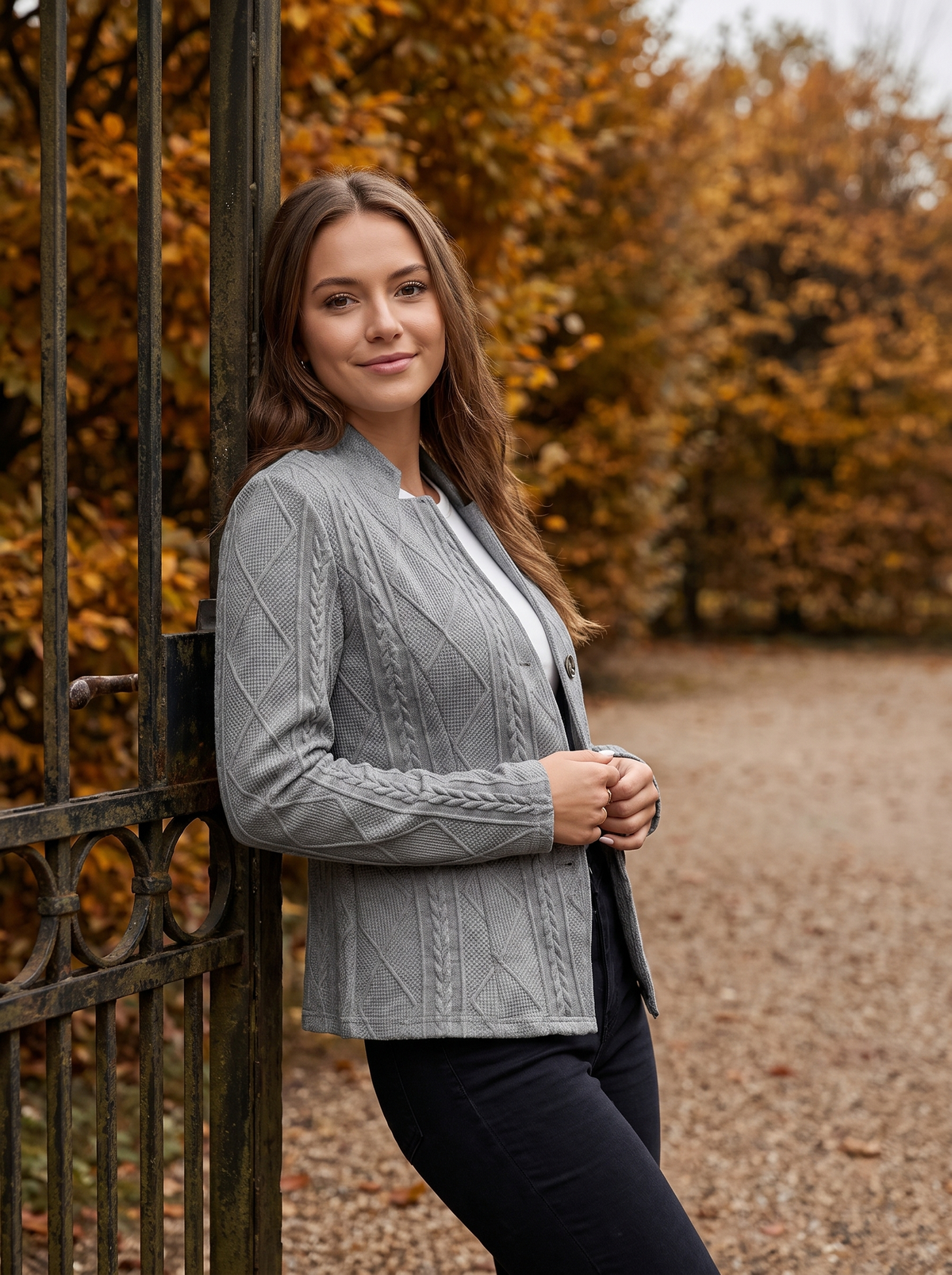 Octavia grey cable knit blazer worn by a model at a park gate in autumn