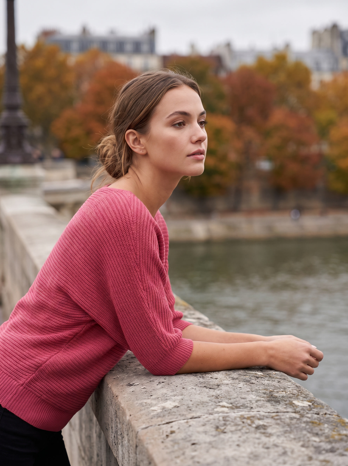 Giselle raspberry three quarter sleeve knit sweater worn by a model on a city bridge in autumn