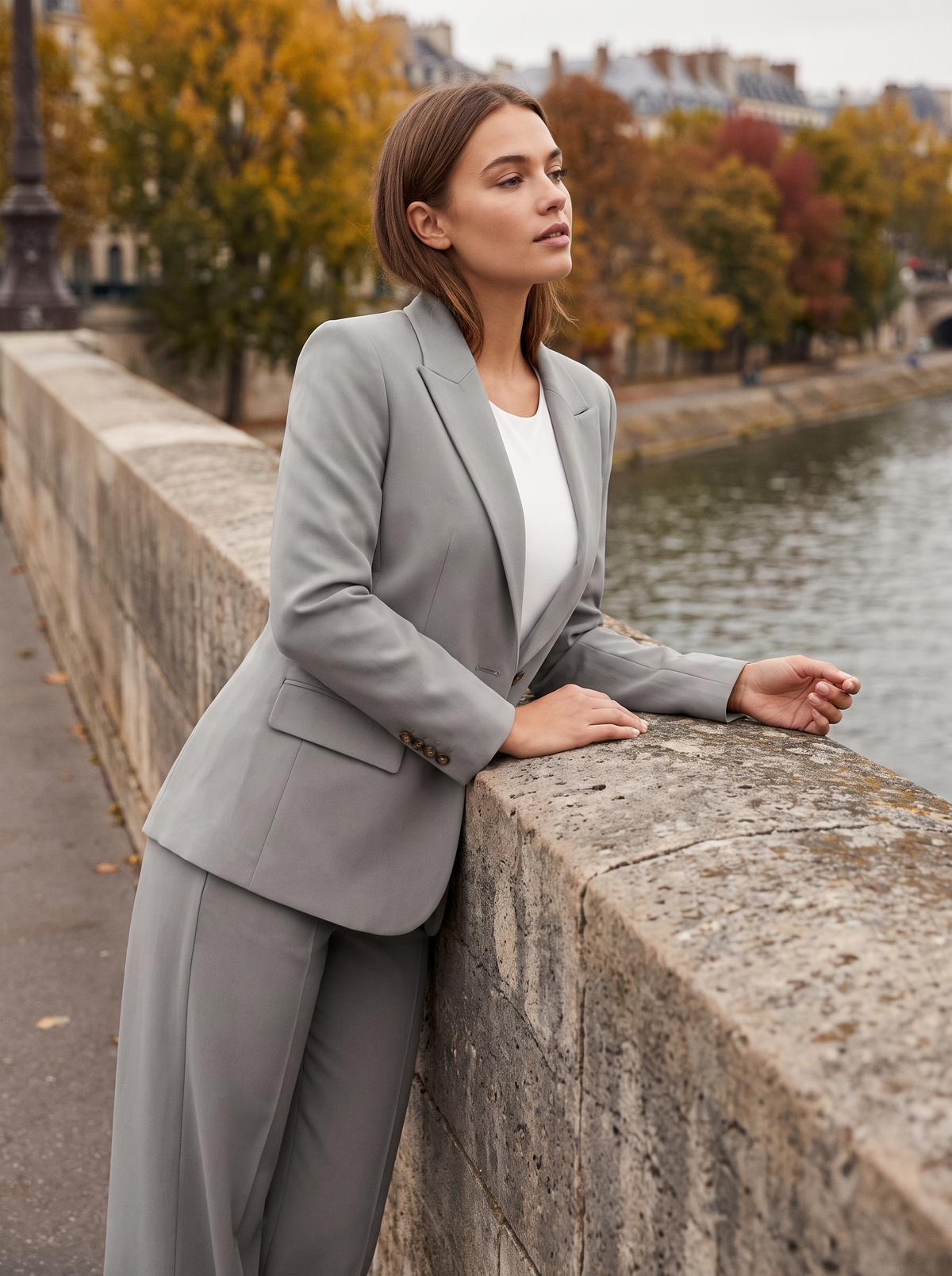 Pomeline grey wide leg blazer suit set worn by a model on a city bridge in autumn