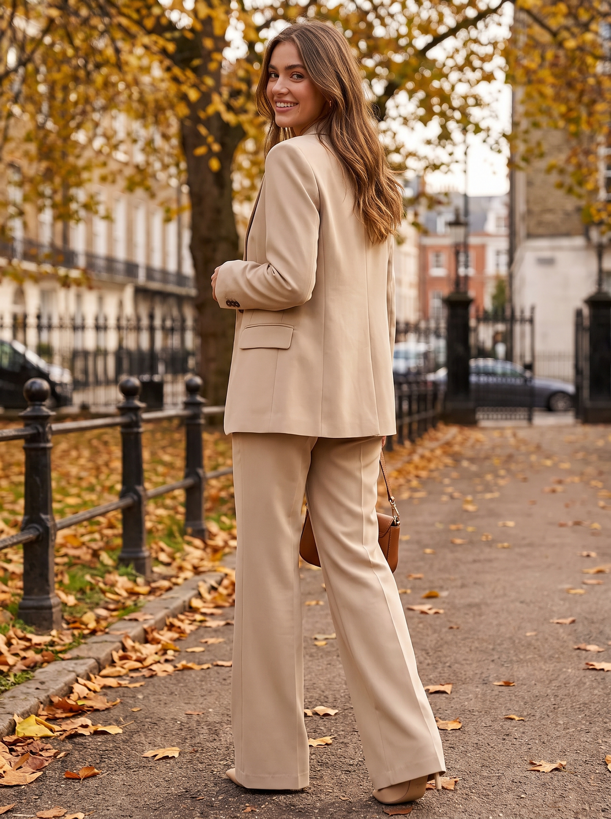 Pomeline beige wide leg blazer suit set worn by a model on an autumn park path in autumn