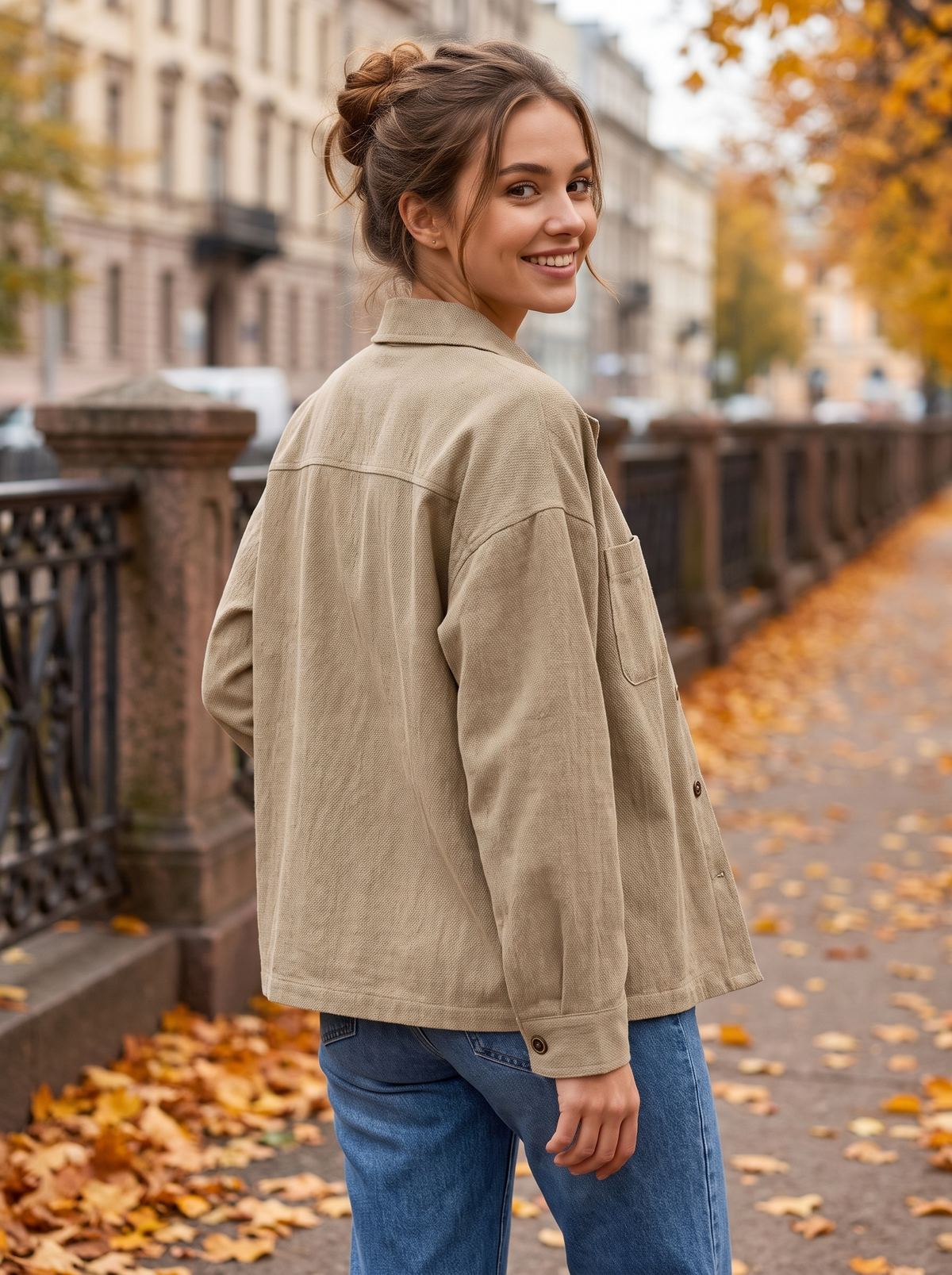 Linnea khaki cotton shirt jacket worn by a model on an autumn park path in autumn