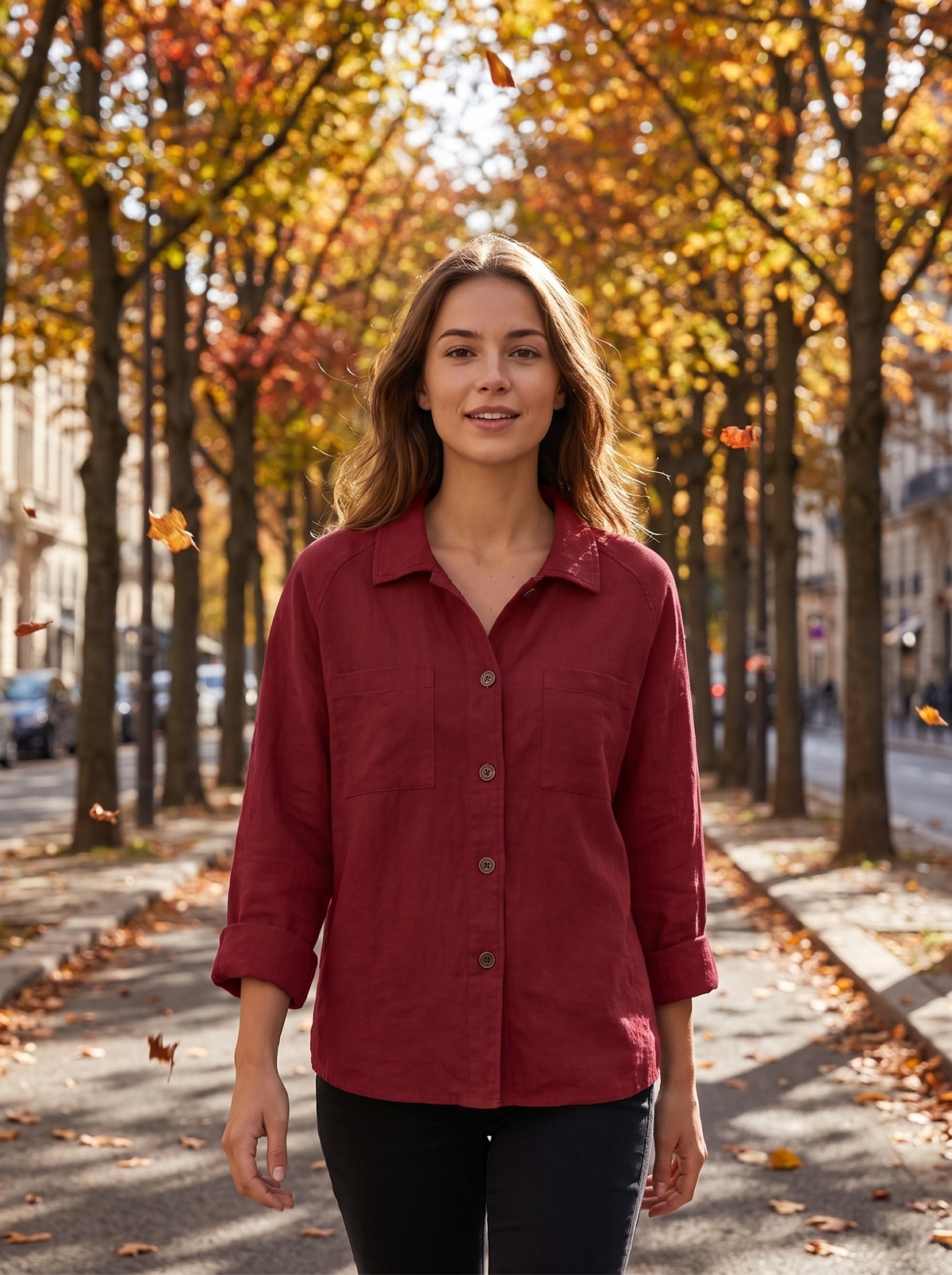 Linnea red cotton shirt jacket worn by a model under an avenue of autumn trees in autumn