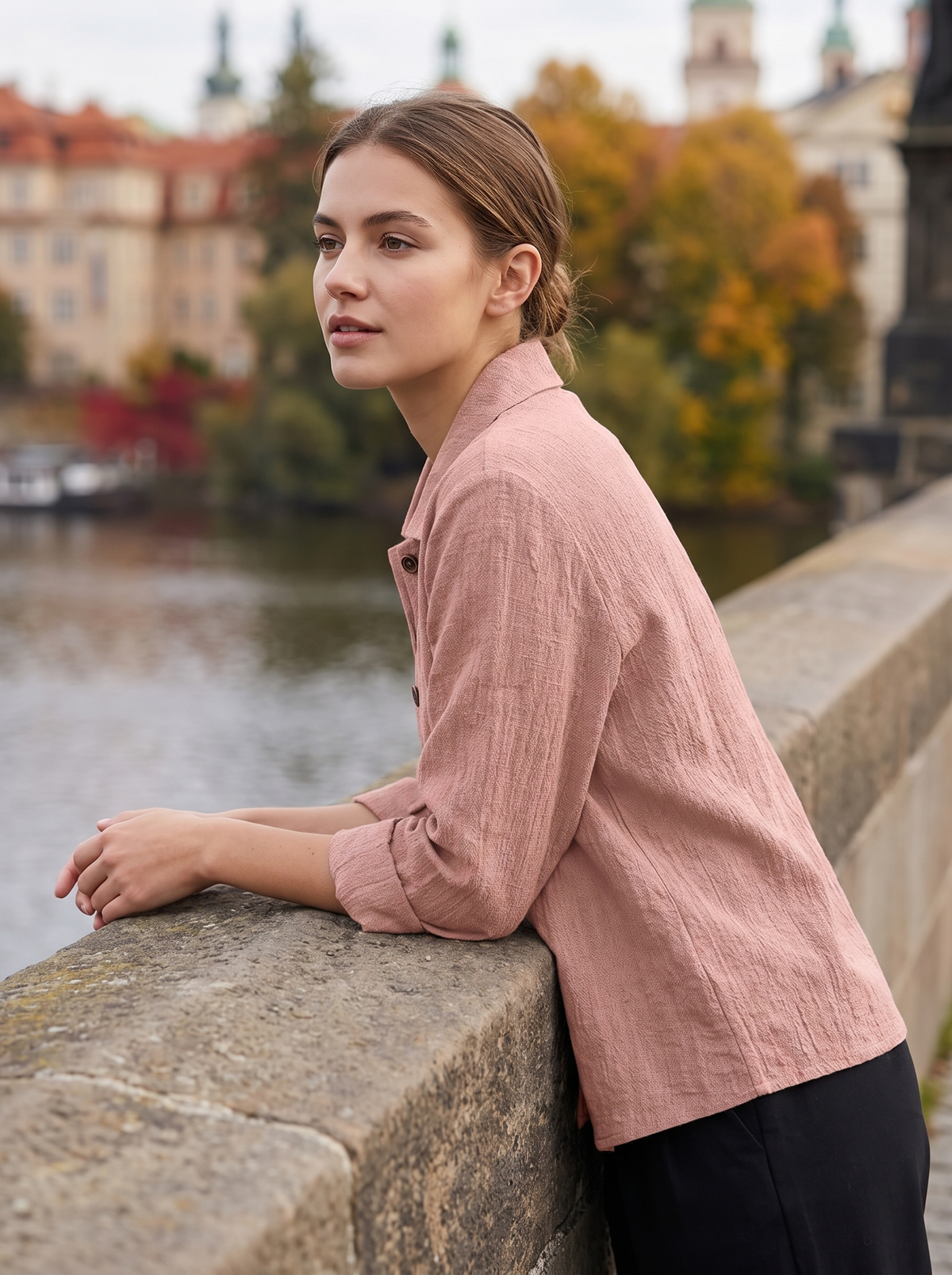 Eulalie pink oversized blazer worn by a model on a city bridge in autumn