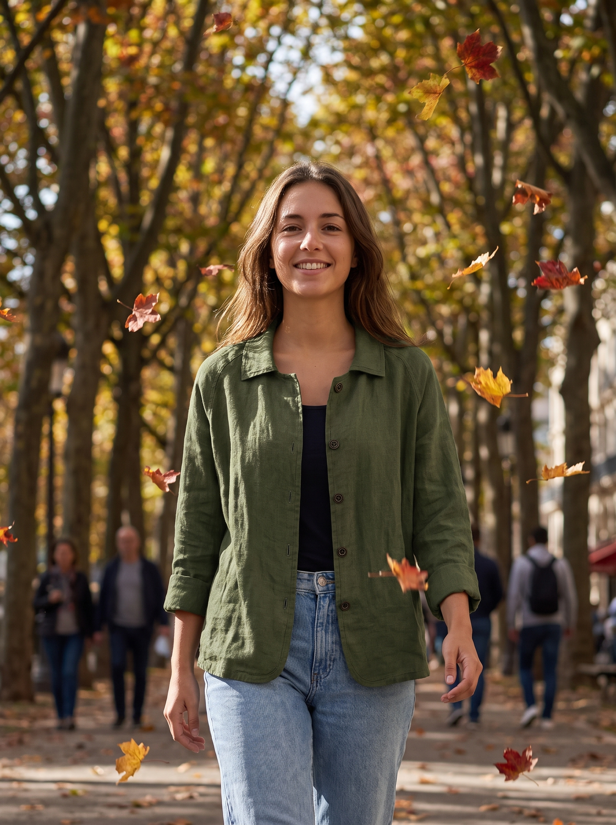 Eulalie dark green oversized blazer worn by a model under an avenue of autumn trees in autumn