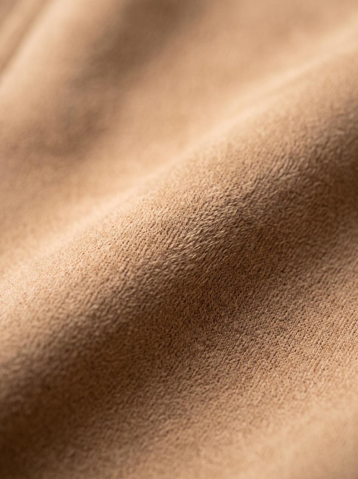 Close up of the fabric of the Romilly suede moto jacket