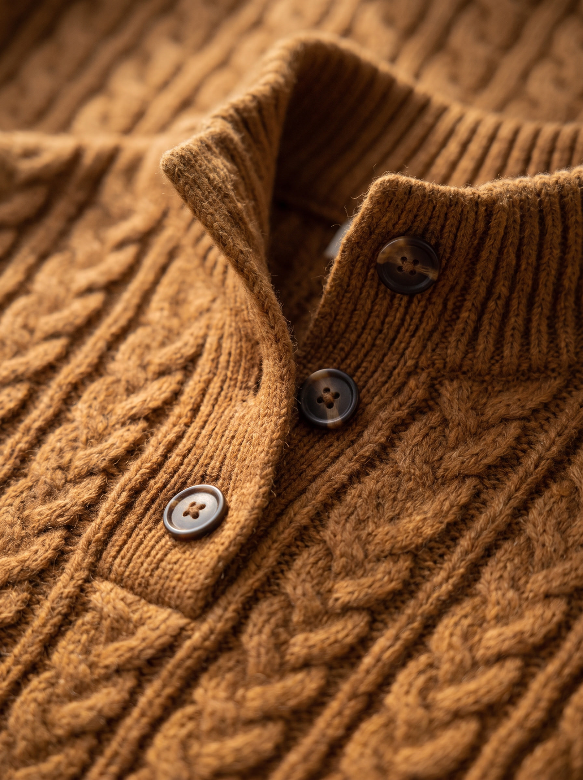 Detail of the Lavinia cable knit sweater showing its material and finish