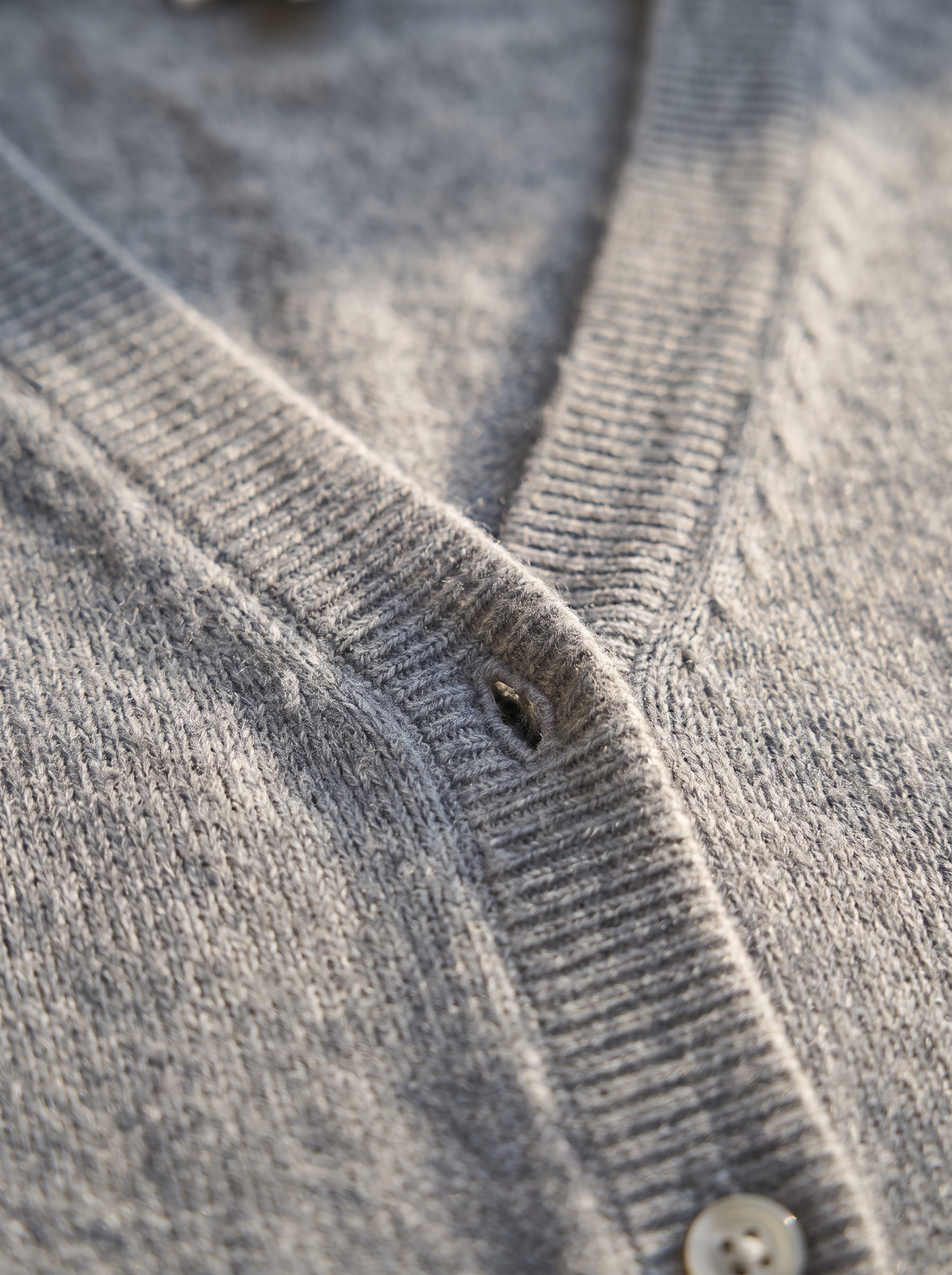 Detail of the Henriette v neck cardigan showing its material and finish
