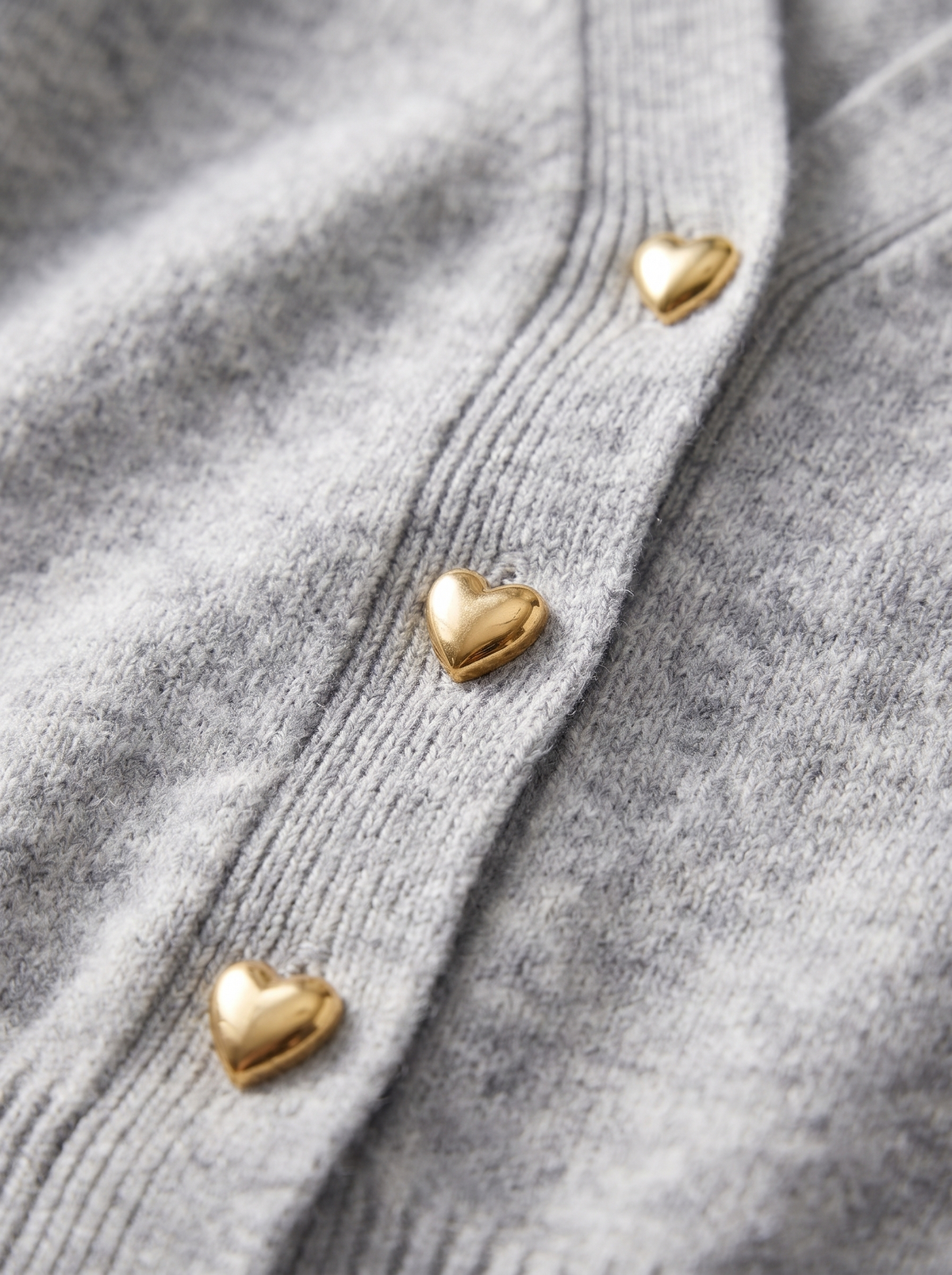 Detail of the Yolande ribbed knit cardigan showing its material and finish