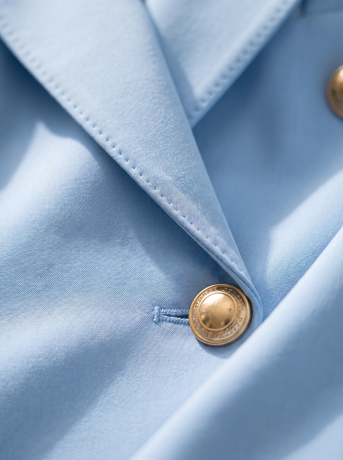 Detail of the Xaviera double breasted blazer suit set showing its material and finish